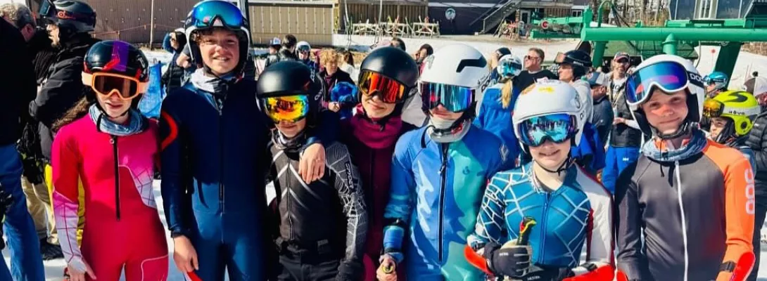 Racers posing together at the bottom of the mountain
