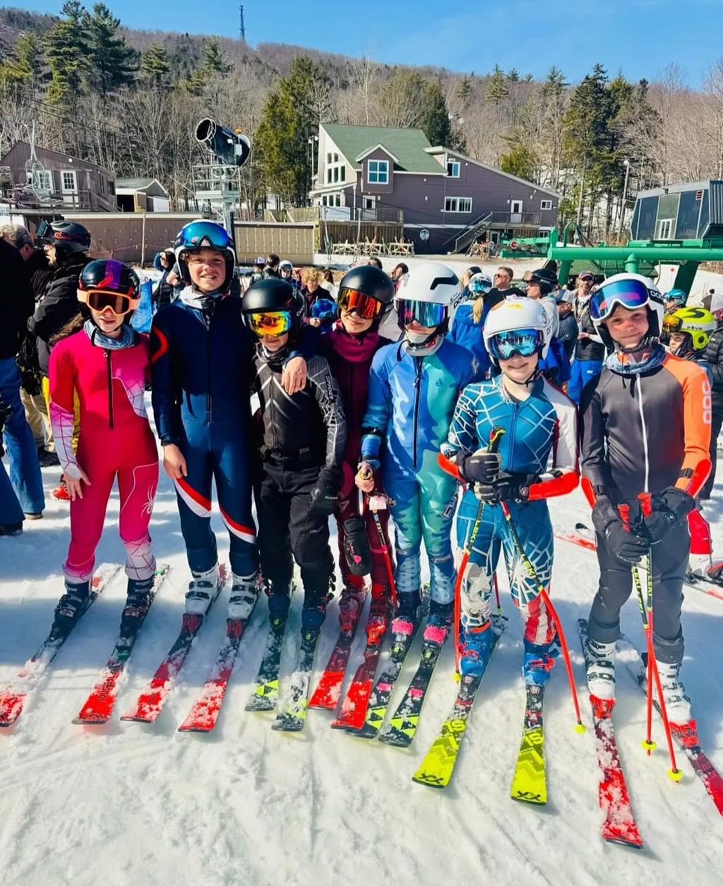 Racers posing together at the bottom of the mountain